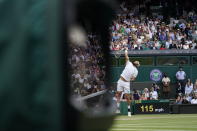 Italy's Matteo Berrettini plays a return to Poland's Hubert Hurkacz during the men's singles semifinals match on day eleven of the Wimbledon Tennis Championships in London, Friday, July 9, 2021. (AP Photo/Alberto Pezzali)