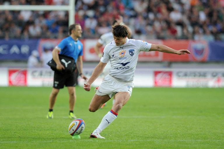 Montpellier fly half Francois Trinh-Duc kicks a penalty during the French Top 14 rugby union match against Grenoble (FCG)on April 12, 2014 at the Stade des Alpes in Grenoble