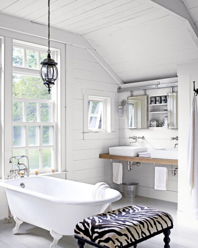 Bathroom Interior with Candles and a ClawFooted Tub · Creative Fabrica