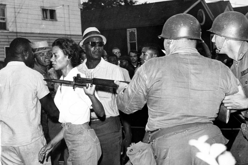 In this July 21, 1963, file photo, Gloria Richardson, head of the Cambridge Nonviolent Action Committee, pushes a National Guardsman’s bayonet aside as she moves among a crowd of African Americans to convince them to disperse in Cambridge, Md. (AP Photo/File)