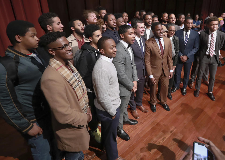 Presidential hopeful Pete Buttigieg, third from left, front row of the group, Mayor of South Bend, Ind., pauses for a group photo with students after speaking at Morehouse College on Monday, Nov. 18, 2019, in Atlanta. (Curtis Compton/Atlanta Journal-Constitution via AP)