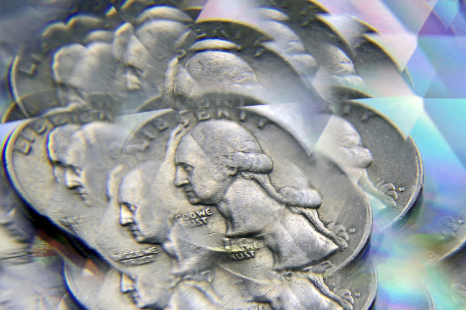 US quarter photographed through a prism, creating a multiple exposure effect focused on George Washington’s face