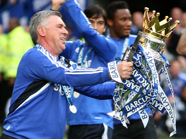 Carlo Ancelotti lifts the Premier League trophy