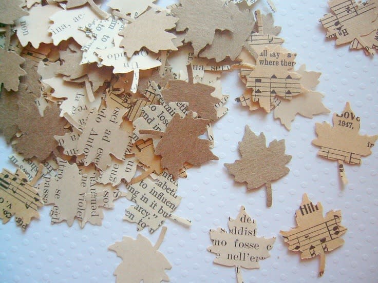 You Can Make Leaf Confetti Either cutting shapes out of actual leaves or cutting leaves out of vintage books and music scores. 