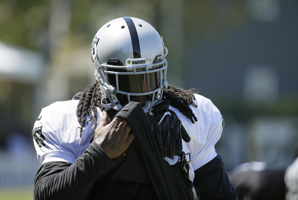 How will Oakland Raiders running back Marshawn Lynch respond after being away from the game for a year? (AP Photo/Eric Risberg)