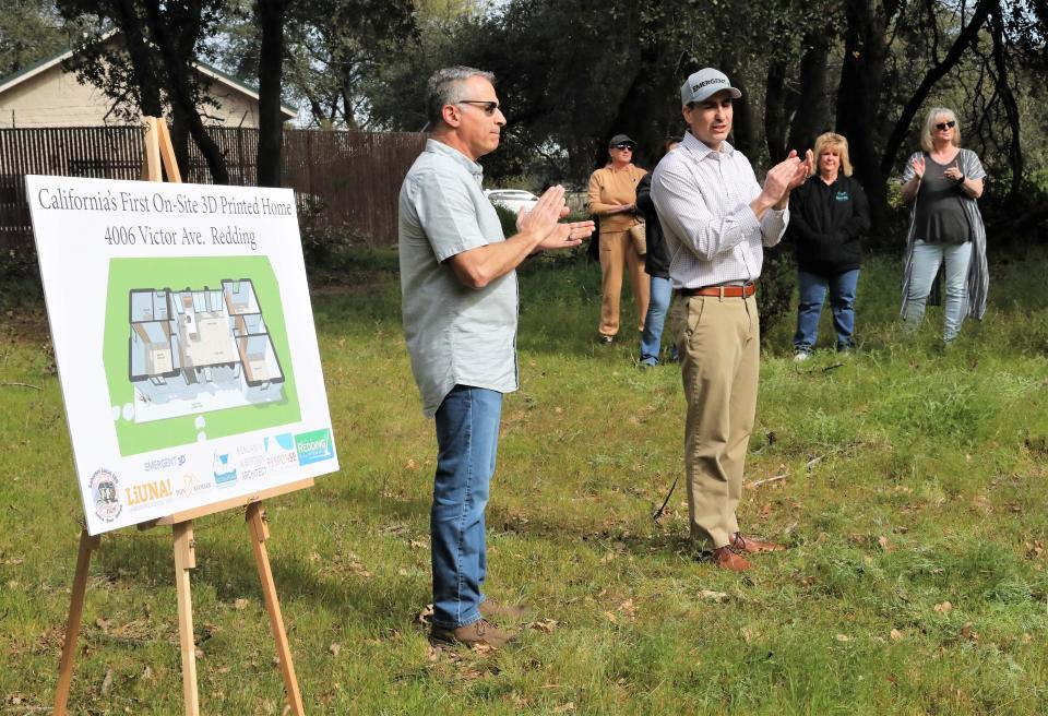 Don Ajamian, president of Don Ajamian Construction, left, and local housing industry entrepreneur Matthew Gile (wearing hat) are business partners in Emergent 3D for the construction of a 3D-printed house at Enterprise Community Park in east Redding.