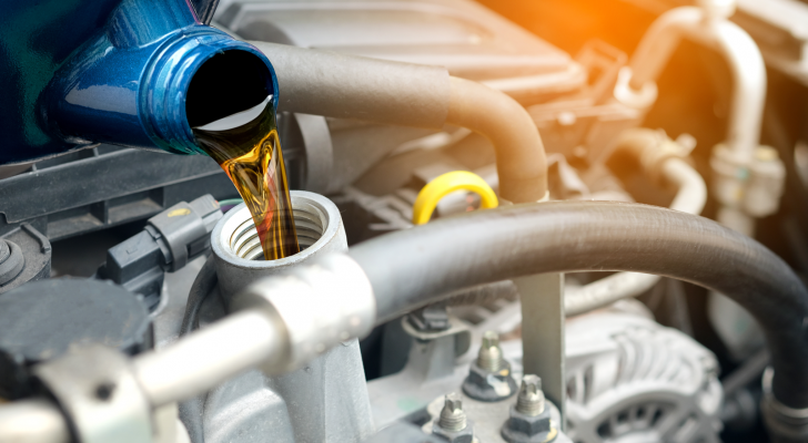 wes stock image of fuel being poured into a vehicle fuel system