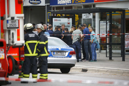 Security forces are seen after a knife attack in a supermarket in Hamburg. REUTERS/Morris Mac Matzen