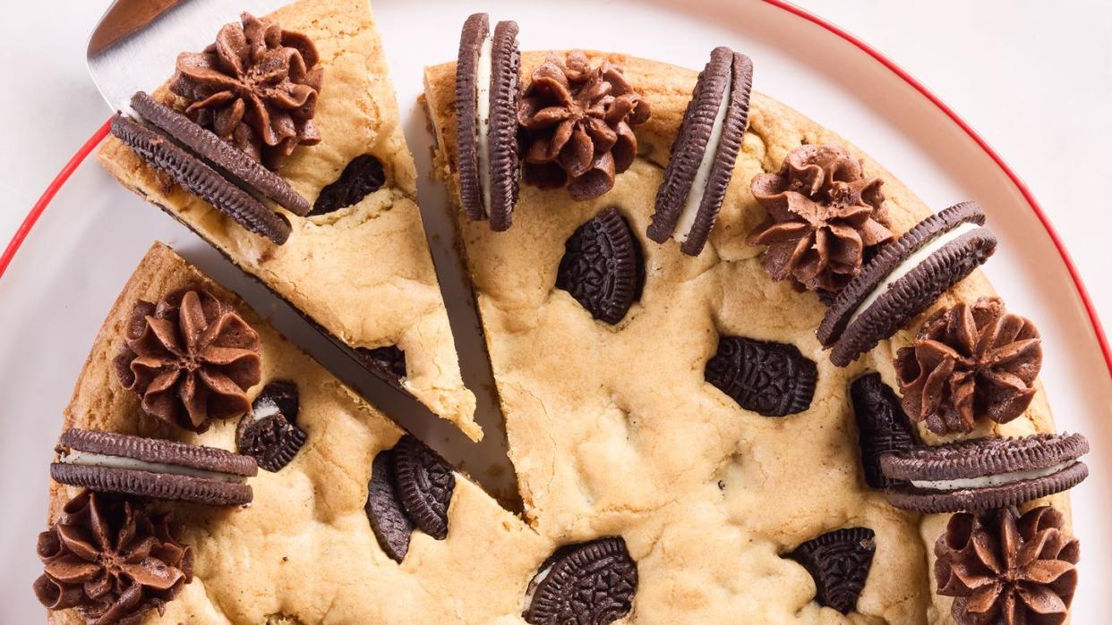 cookie cake with oreos mixed in and on top with chocolate frosting