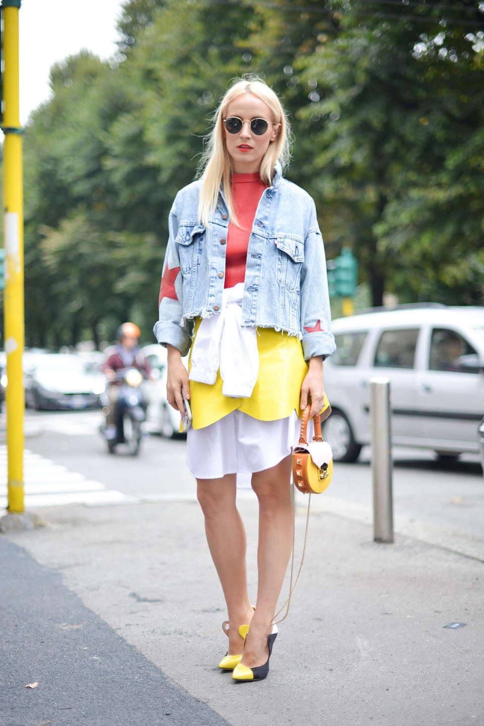 A street-styler does edgy-feminine right  with a frayed hem denim jacket