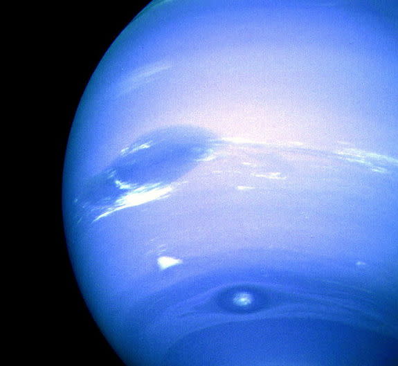 This image of Neptune was captured by NASA's Voyager 2 spacecraft during an August 1989. Neptune's Great Dark Spot dominates the center along with bright, white. To the south is the bright feature nicknamed "Scooter." Still farther south is the