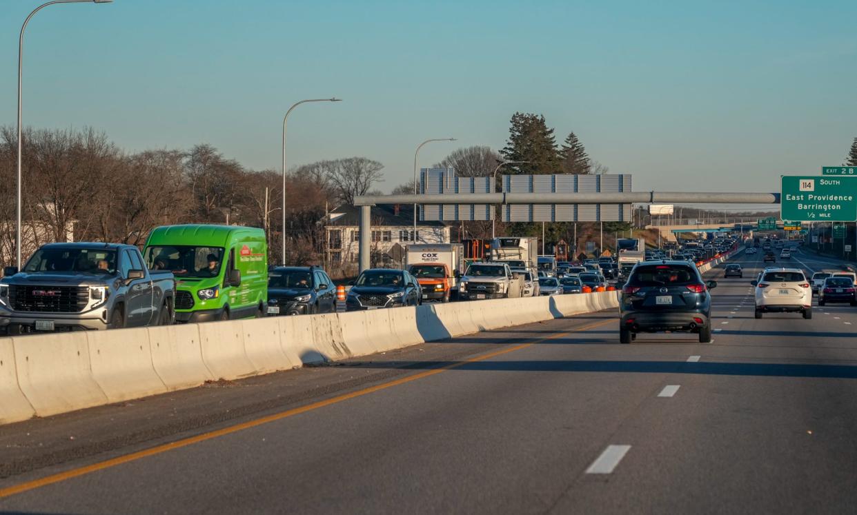 Westbound traffic backs up on Interstate 195 as drivers near the merge into temporary bypass lanes on the eastbound side of the Washington Bridge on Dec. 15, 2023, four days after the westbound lanes closed.  [David DelPoio/The Providence Journal, file]
