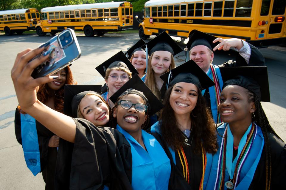 May 18, 2022; Tuscaloosa, AL, USA; Students prepare for graduation for the Northridge High School Class of 2022 at the Tuscaloosa Amphitheater Wednesday. Aisia Bell takes a selfie with a group of friends before the ceremony. Gary Cosby Jr.-The Tuscaloosa News