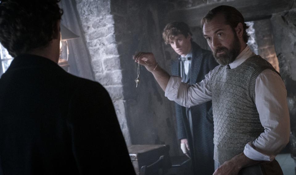 Albus Dumbledore (far right, Jude Law) has a new mission for Theseus (Callum Turner) and Newt (Eddie Redmayne) in "Fantastic Beasts: The Secrets of Dumbledore."