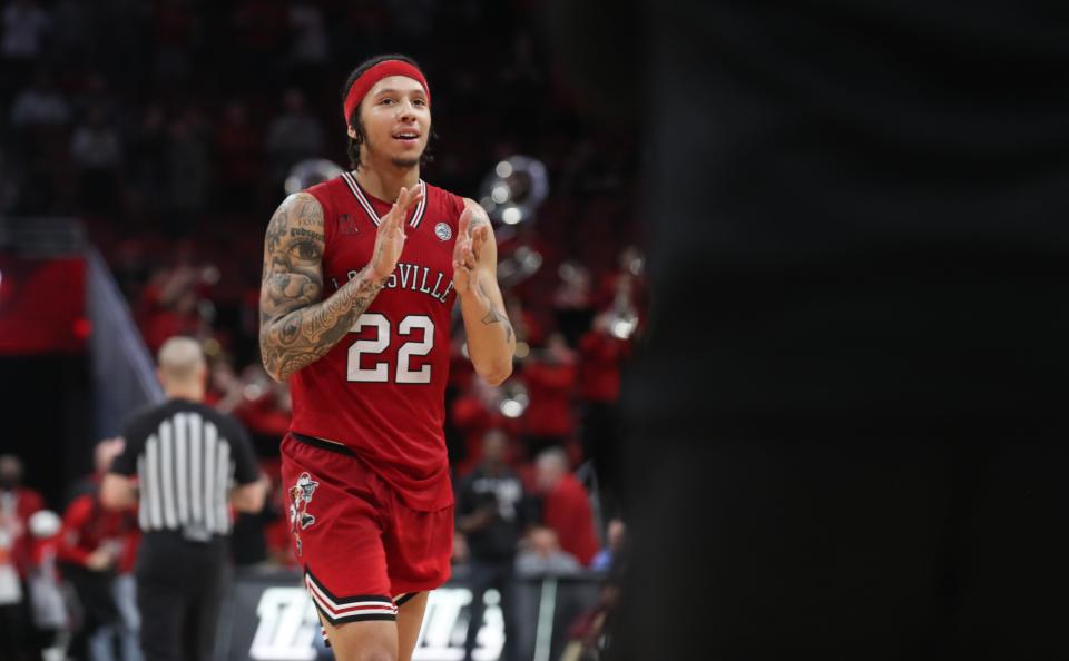 Louisville’s Tre White celebrates the victory against Georgia Tech on Saturday night. White scored 14 points.