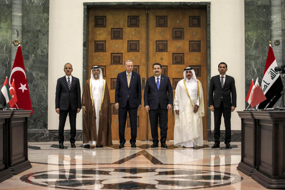 Iraq's Prime Minister Mohammed Shia al-Sudani, third right, Turkey's President Recep Tayyip Erdogan, third left, Qatar's Minister of Transport Jassim bin Saif bin Ahmed al-Sulaiti, second right, and UAE's Minister of Energy Suhail Mohamed al-Mazrouei, second left, pose for a picture during their meeting in Baghdad, Iraq, Monday April 22, 2024. (Ahmad Al-Rubaye/Pool via AP)