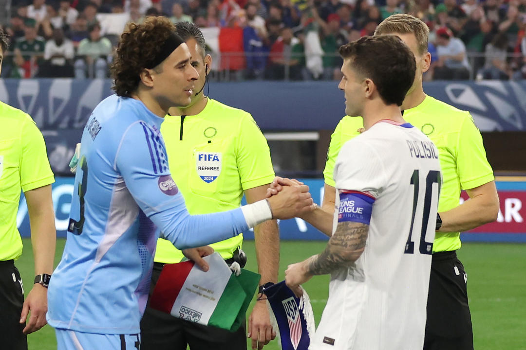 ARLINGTON, TEXAS - MARCH 24: Guillermo Ochoa #13 of Mexico  shakes hands with Christian Pulisic #10 of the United States during the coin toss prior to the Concacaf Nations League Final at AT&T Stadium on March 24, 2024 in Arlington, Texas. (Photo by John Dorton/ISI Photos/USSF/Getty Images for USSF)