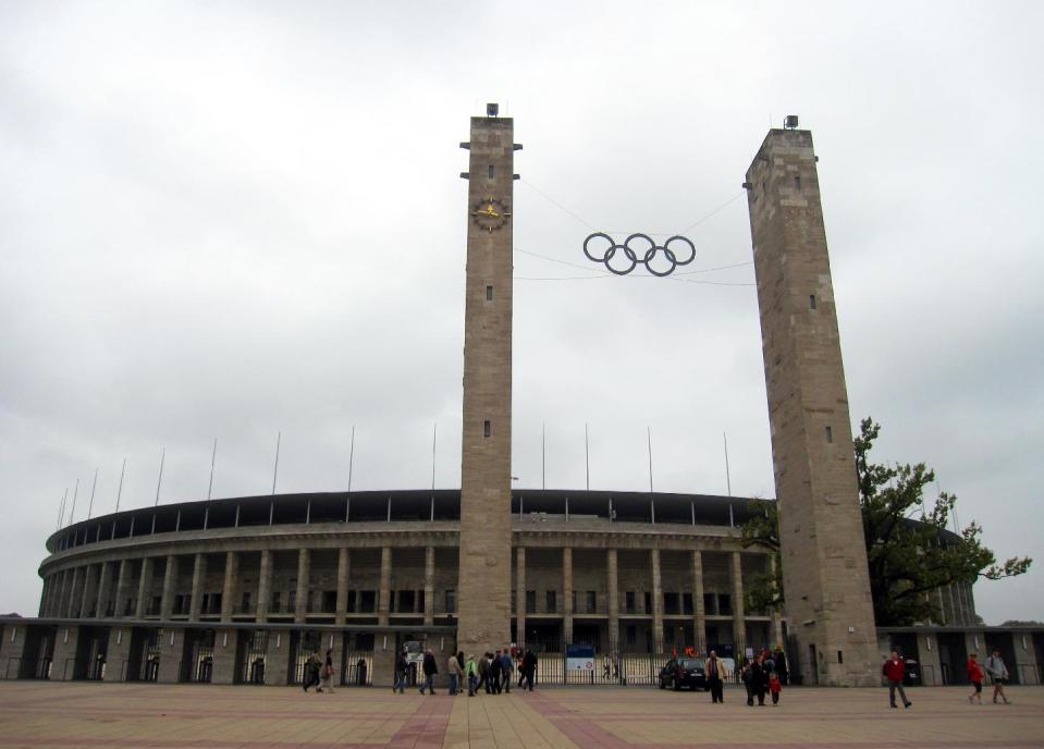 This Sept. 25, 2010 photo shows the Olympic rings on the approach to Olympiastadion Berlin, where U.S. gold medalist Jesse Owens won four gold medals during the 1936 Summer Olympics in Berlin, Germany. Germany hosted two notorious games: The 1936 Berlin Olympics, which Adolf Hitler tried to turn into a showcase of Aryan supremacy, and the 1972 Munich Olympics, married by a hostage crisis that left 11 Israelis dead. A tour takes you to the stands overlooking the track area where Owens and other athletes competed. (AP Photo/Anick Jesdanun)