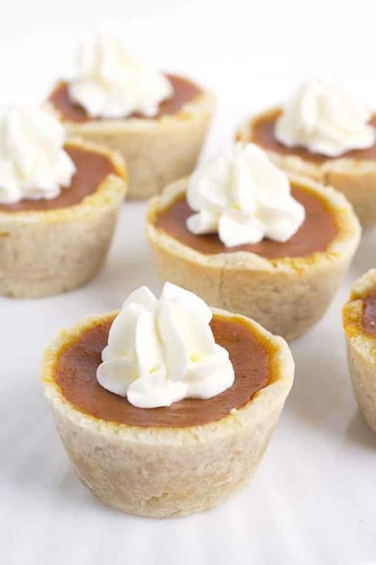 <p>Cookie Dough and Oven Mitt</p><p>These mini maple pumpkin pies are perfect to serve at your Thanksgiving dessert table or to just kick Fall off with. Top them with a dollop of fresh whipped cream and they are ready!</p><p><strong>Get the recipe: <a href="https://www.cookiedoughandovenmitt.com/mini-maple-pumpkin-pies/" rel="nofollow noopener" target="_blank" data-ylk="slk:Mini Pumpkin Cheesecakes;elm:context_link;itc:0;sec:content-canvas" class="link ">Mini Pumpkin Cheesecakes</a></strong></p>