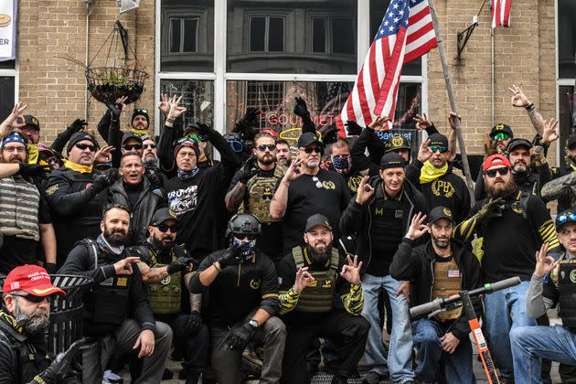 Members of the Proud Boys pose for a photo while flashing a gesture associated with the white power movement outside of Harry's bar during a protest on December 12, 2020, in Washington, D.C. Fischer was among them.  (Photo: Stephanie Keith via Getty Images)