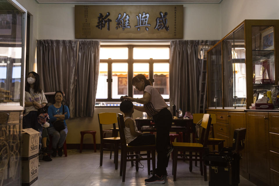 A child is being applied make up prior to participate in Piu Sik Parade at the Bun Festival in Cheung Chau Islandin the Piu Sik Parade at Bun Festival in Cheung Chau Island in Hong Kong, Friday, May 26, 2023. (AP Photo/Louise Delmotte)