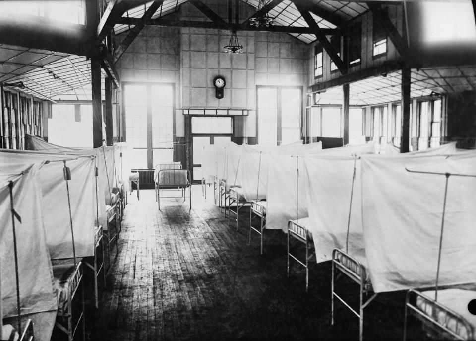 <span class="caption">In the U.S., 675,000 died from the 1918 influenza pandemic.</span> <span class="attribution"><a class="link " href="https://www.gettyimages.com/detail/news-photo/red-cross-house-at-u-s-general-hospital-during-influenza-news-photo/1223011438?adppopup=true" rel="nofollow noopener" target="_blank" data-ylk="slk:Getty Images / Universal History Archive;elm:context_link;itc:0;sec:content-canvas">Getty Images / Universal History Archive</a></span>