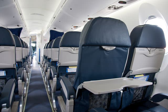 <p>Mint Images/Getty</p> Seats at the back of a plane