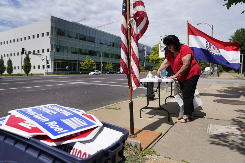 FILE - Defenders of the Unborn founder Mary Maschmeier, sets up a table outside Planned Parenthood on June 24, 2022, in St. Louis. Most abortions are now illegal in Missouri following a U.S. Supreme Court decision that ended a constitutional protection for abortion. (AP Photo/Jeff Roberson, File)