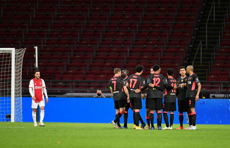 Liverpool celebrate after taking the lead in Amsterdam (REUTERS)