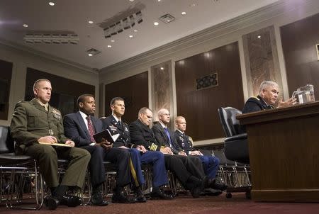 U.S. Army General John Campbell, commander of the Resolute Support Mission and United States Force - Afghanistan, testifies before a Senate Armed Services Committee hearing on "The Situation in Afghanistan" as his staff watches on Capitol Hill in Washington October 6, 2015. REUTERS/Joshua Roberts