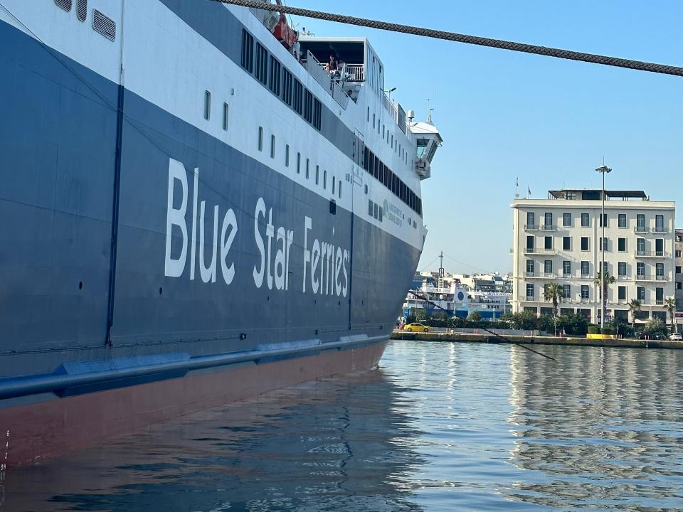 blue star terries boat docked at a port in greece