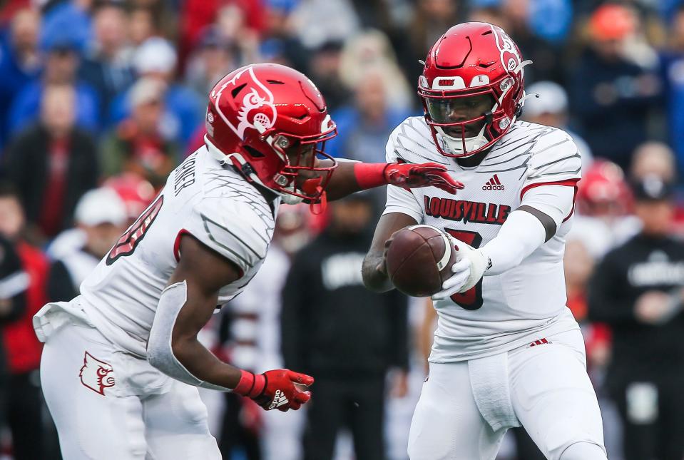 Louisville quarterback Malik Cunningham (3) hands off to Louisville running back Maurice Turner in the first half in the 2022 Governor's Cup game between Kentucky and Louisville. Nov. 26, 2022