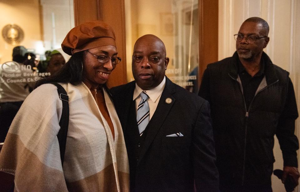 Dr. Abram Muhammad walks out of the Jackson City Council meeting with his wife, Tracy, after being approved as the new director of the city's Department of Parks & Recreation during the meeting at Jackson City Hall in Jackson on Wednesday.