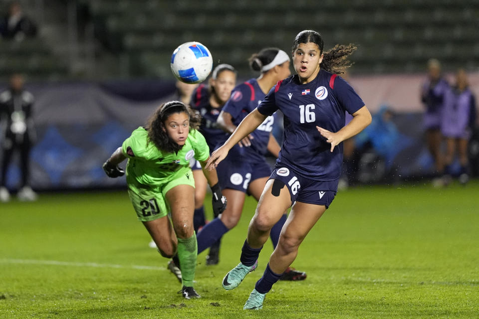 Dominican Republic goalkeeper Paloma Pena Toro (20) and Renata Mercedes Puello chase the ball during the first half of the CONCACAF Women’s Gold Cup soccer tournament against the United States at Dignity Health Sports Park in Carson, Calif., Tuesday, Feb. 20, 2024. (AP Photo/Damian Dovarganes)