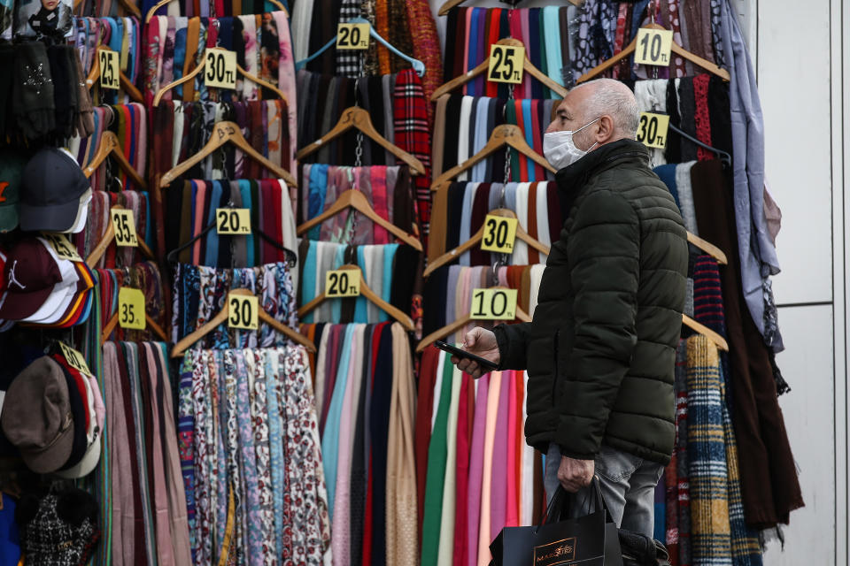 ISTANBUL, TURKEY - MAY 7: A man shops at nearly empty Istiklal Street as people stay at home within coronavirus (Covid-19) precautions in Istanbul, Turkey on May 7, 2020. (Photo by Onur Coban/Anadolu Agency via Getty Images)