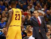 Dec 11, 2015; Orlando, FL, USA; Cleveland Cavaliers forward LeBron James (23) high fives head coach David Blatt (R) against the Orlando Magic during the second half at Amway Center. The Cavaliers won 111-76. Mandatory Credit: Kim Klement-USA TODAY Sports