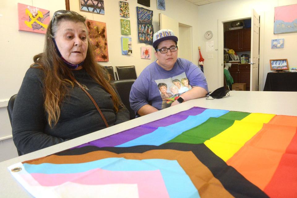  Linda Maria Calabro of Taftville, left, and Dasya Butts of Norwich, clients at Reliance Health support raising the LGBTQ+ flag at Norwich City Hall.