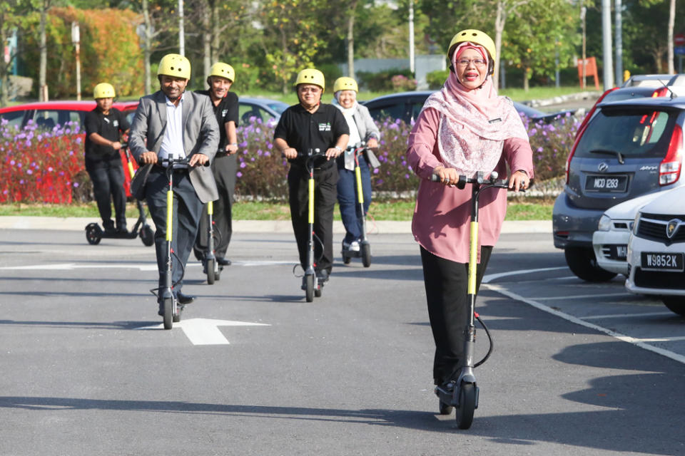 People try out the Tryke e-scooters during its soft launch at RekaScape in Cyberjaya November 22, 2019.