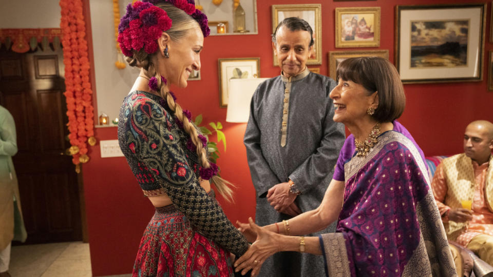 Carrie meeting Seema's parents at a Diwali celebration