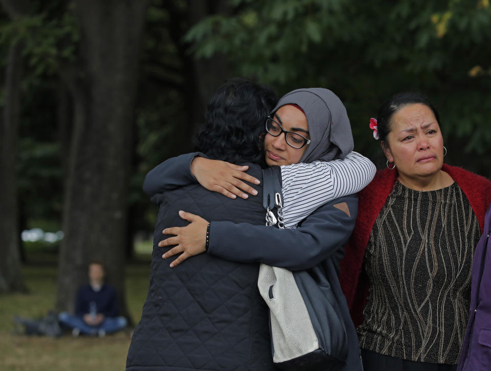 Mourners hug after paying their respects to the victims near the Masjid Al Noor mosque in Christchurch. Source: AP