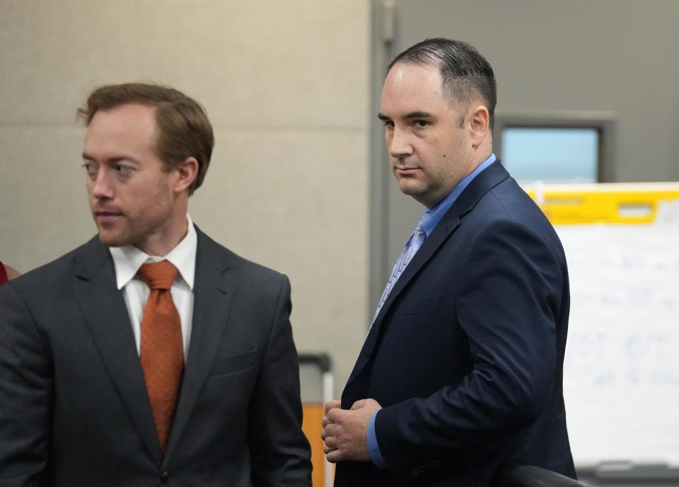 Daniel Perry, right, attends his trial in the shooting of Garrett Foster.