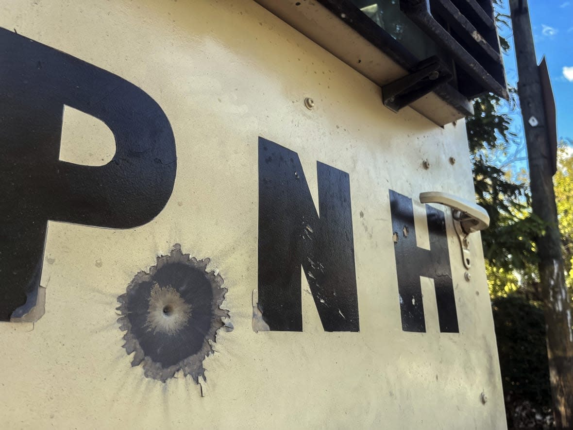 A bullet’s impact is seen on an armored police car in Port-au-Prince, Haiti, Saturday, Jan. 21, 2023. One of Haiti’s gangs stormed a key part of the capital, Port-Au-Prince, and battled with police throughout the day, leaving at least three officers dead and another missing. (AP Photo/Megan Janetsky)