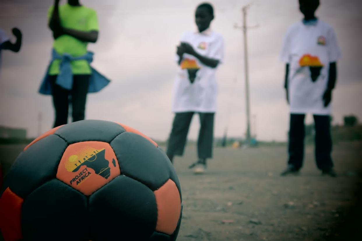 A football with the logo for Project Africa 