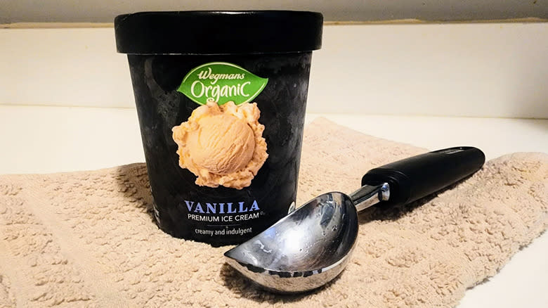 Pint of organic ice cream with scooper