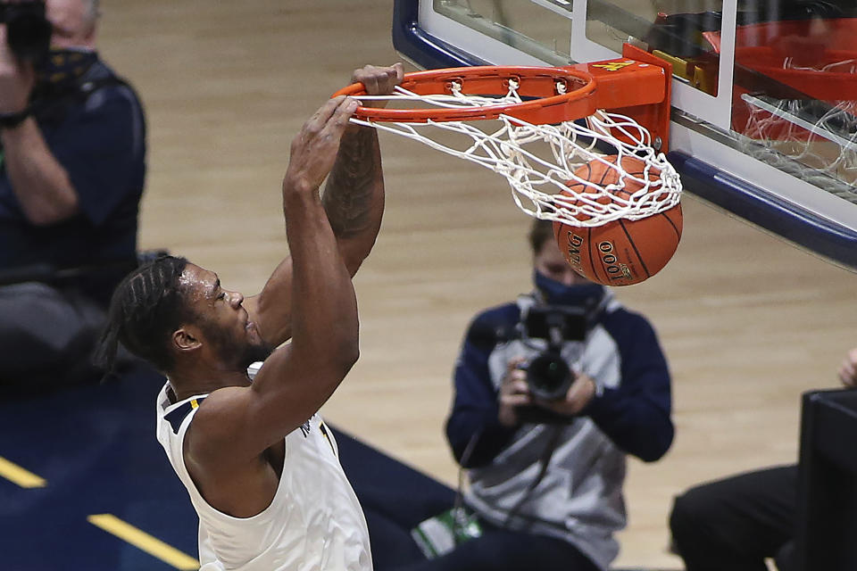 West Virginia forward Derek Culver (1) shoots during the second half of an NCAA college basketball game against Northeastern Tuesday, Dec. 29, 2020, in Morgantown, W.Va. (AP Photo/Kathleen Batten)