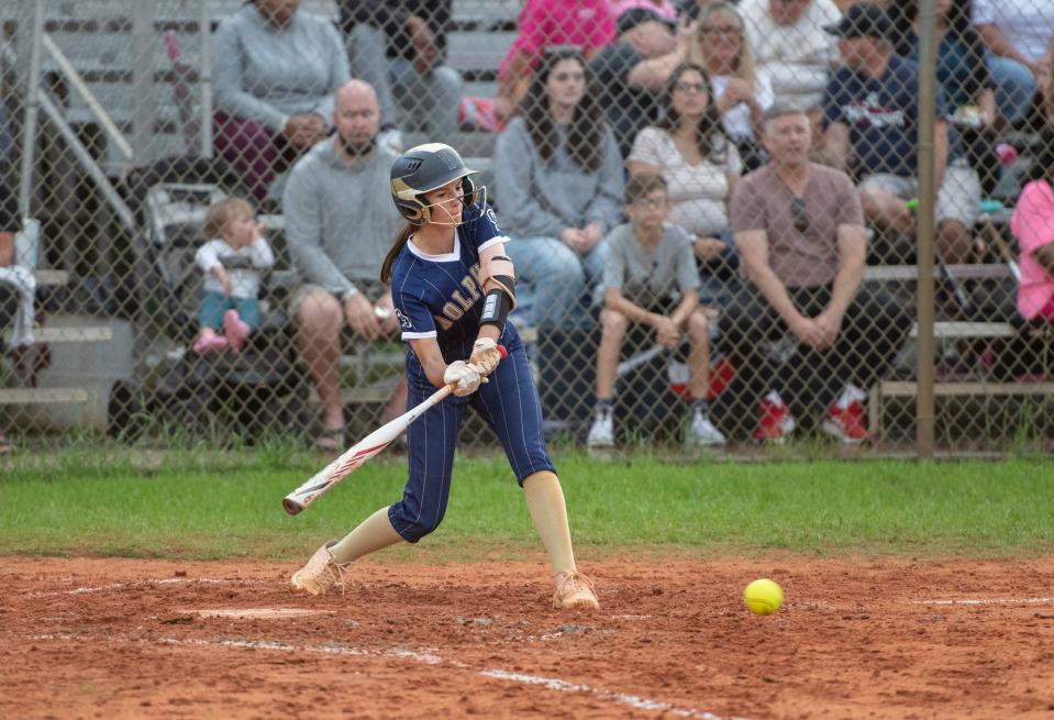 Jasmine Johnson (1) makes contact during the Gulf Breeze vs Navarre softball game at Navarre High School on Tuesday, April 26, 2022.