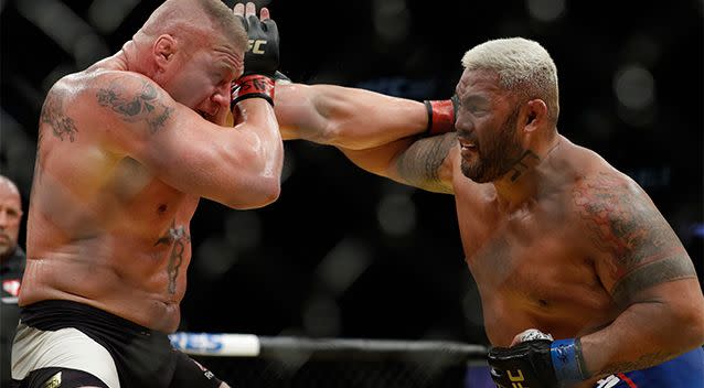 Heavyweights Brock Lesnar and Mark Hunt exchange blows at UFC 200. Photo: AP