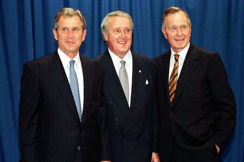 Brian Mulroney (C) played a key role in negotiating the original North American Free Trade Agreement with former Mexican President Carlos Salinas and U.S. President George H.W. Bush (R). File Photo by George Wong/UPI