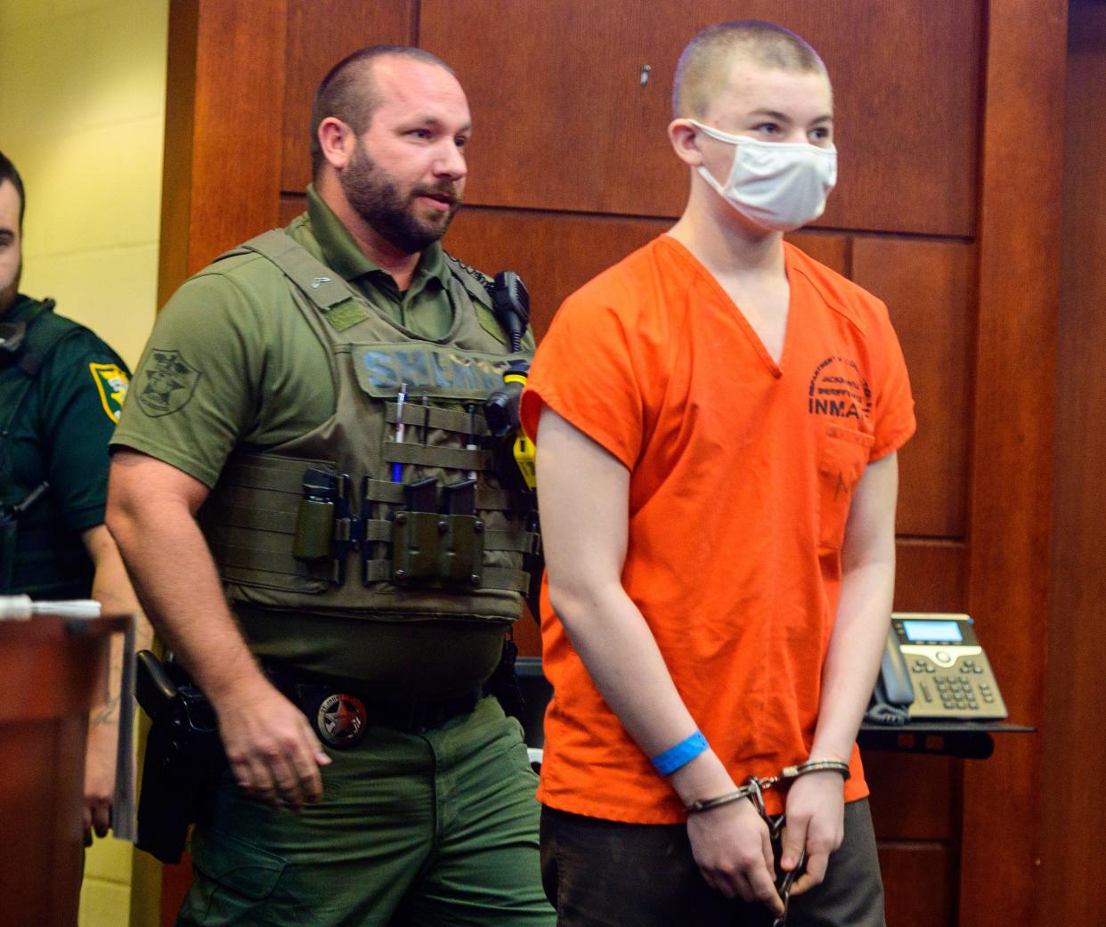 Aiden Fucci walks into Circuit Judge Lee Smith’s courtroom in the St. Johns County courthouse in St. Augustine on Thursday, Oct. 28, 2021, to attend a pretrial hearing. Fucci, 14, is accused in the stabbing death of 13-year-old Tristyn Bailey in May.