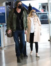 <p>Mom-to-be Emma Roberts and boyfriend Garrett Hedlund arrive at LAX on Sunday, wearing sunglasses and comfy airport attire.</p>